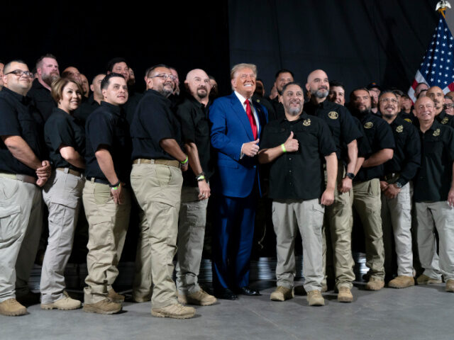 U.S. Republican presidential nominee, former President Donald Trump poses for a picture wi