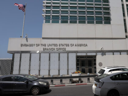 Cars drive in front of the US Embassy branch office in Tel Aviv on April 19, 2024. (JACK G