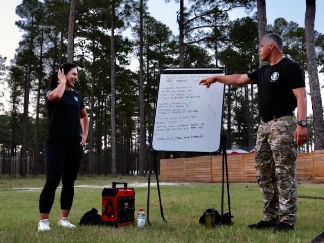 Tulsi Gabbard participates in a workout at Camp MacKall with a training group of Special F
