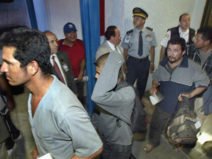 A group of migrants deported by the United States leave 12 July, 2004 Mexico City's i