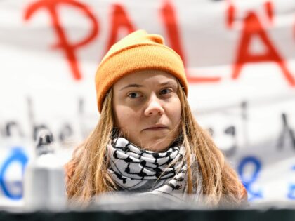 06 December 2024, Baden-Württemberg, Mannheim: Activist Greta Thunberg sits on the podium