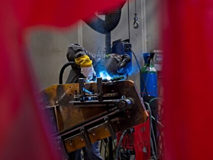 A picture taken on July 4, 2022, in Bourges shows a worker making welds on the barrel crad