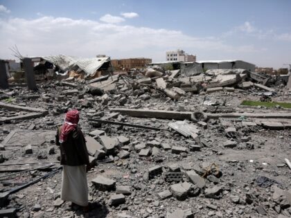 SANA'A, YEMEN - APRIL 27: A man inspects his building after it was targeted by US aer