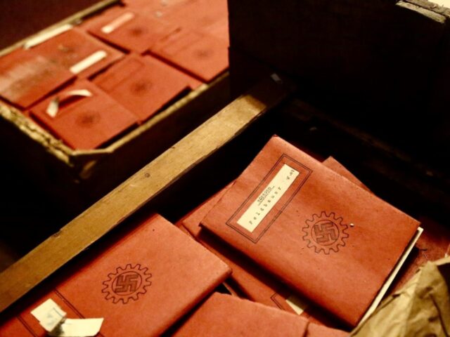 Membership notebooks with Nazi symbols found inside the boxes. Credit: Argentina Supreme C