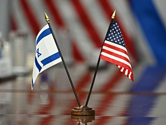 israel and america Israeli and US flags are seen on the table as US Secretary of Defense Pete Hegseth meets w