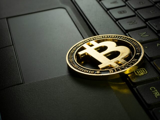 Bitcoin emblem on a laptop