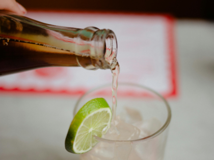 pouring drink from a bottle