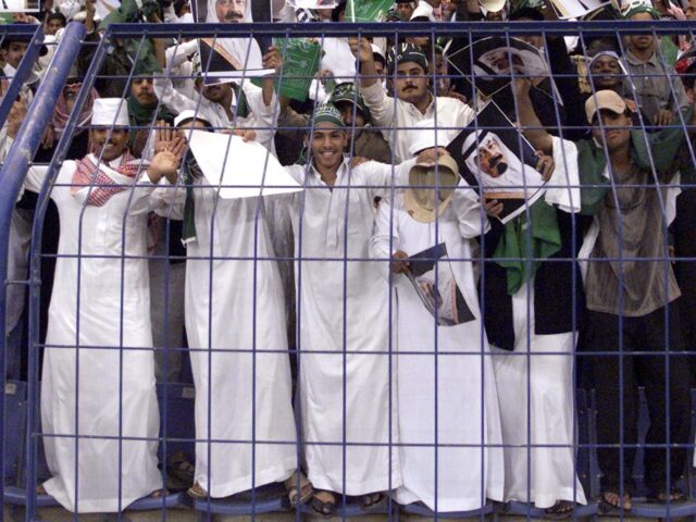 saudi world cup Saudi supporters wave pictures of King Fahd and of Crown Prince Abdullah during the final