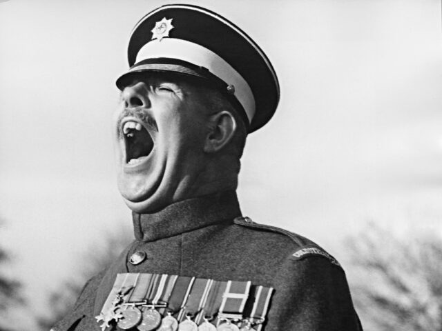 sefgeant major shouts Regimental Sergeant Major Ronald Brittain (1899 - 1981) of the Coldstream Guards receives