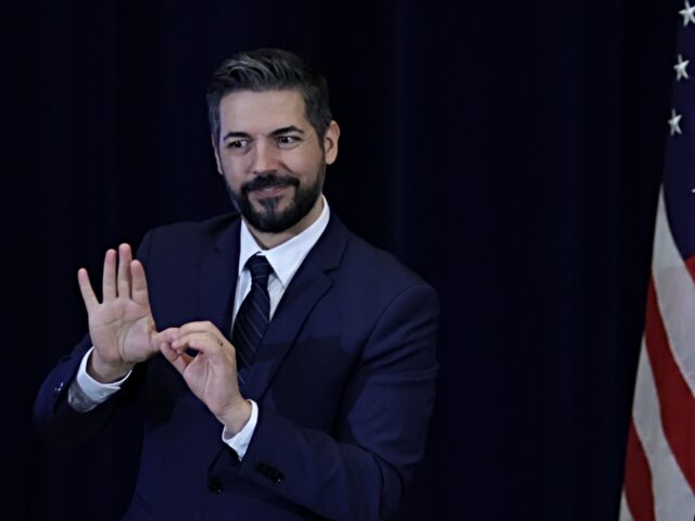 WASHINGTON, DC - MARCH 28: With the help of a sign language interpreter, U.S. Secretary of