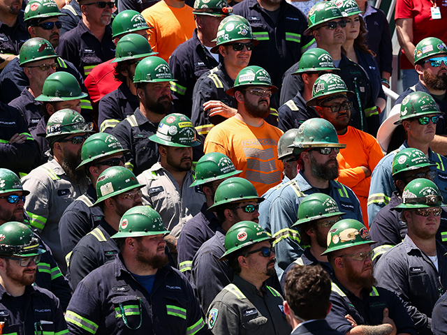 Workers listen as Vice President JD Vance speaks at Nucor Steel Berkeley in Huger, South C