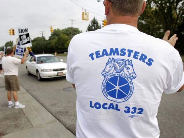 teamsters unite FLINT - SEPTEMBER 25: Members of Teamsters Local 332 in Flint watch over the picket line a