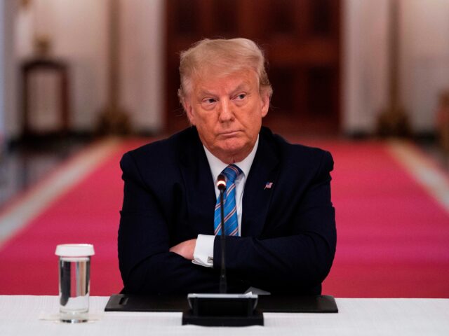 OPSHOT - US President Donald Trump sits with his arms crossed during a roundtable discussi