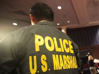 NEW YORK - NOVEMBER 13: A U.S. Marshal looks on during a press preview of a U.S. Marshals