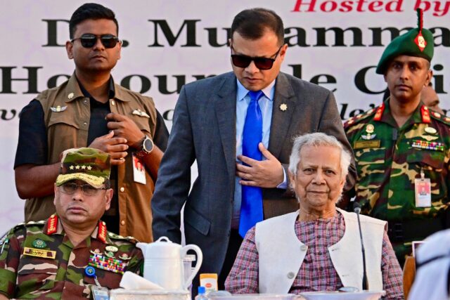Bangladesh's army chief Waker-Uz-Zaman (L) wants elections by December -- seen here sittin