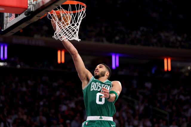 Boston's Jayson Tatum drives to the hoop for a layup as trhe Celtics beat New York 115-93
