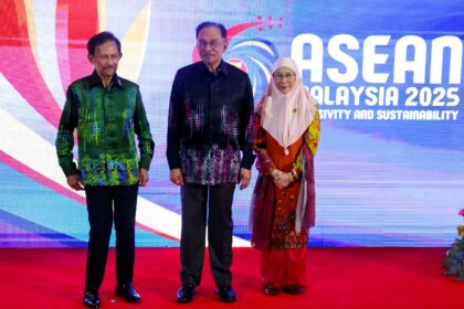 Brunei's Sultan Hassanal Bolkiah (L, with Malaysian Prime Minister Anwar Ibrahim) was in K