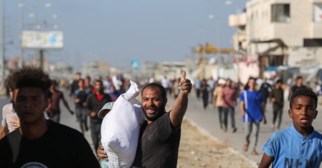 Two Dead as Thousands Storm UN Food Warehouse in Gaza Amid Hunger Crisis