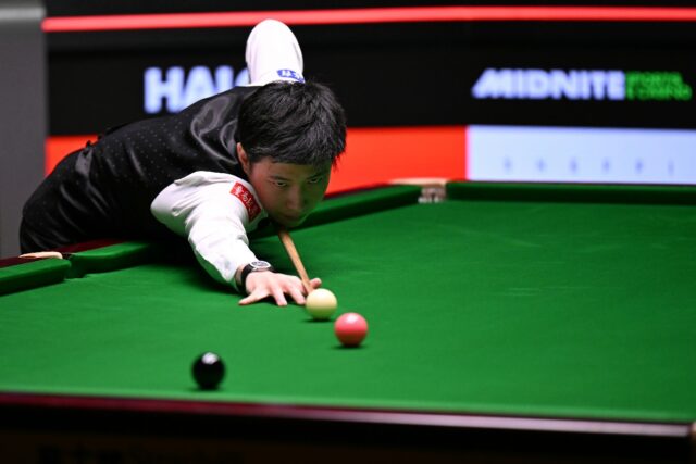 China's Zhao Xintong in action against Mark Williams in the World Snooker Championship fin