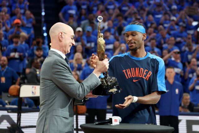 Commissioner of the NBA Adam Silver presents Shai Gilgeous-Alexander of the Oklahoma City