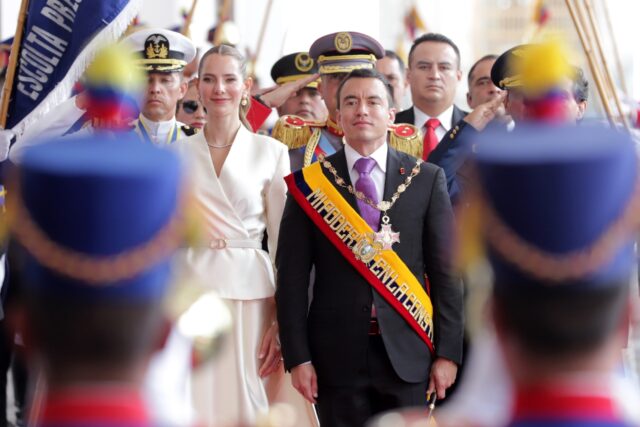 Ecuador's re-elected President Daniel Noboa (C) and his wife, First Lady Lavinia Valbonesi