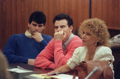 Erik Menendez (C) and his brother Lyle are asking a judge to reduce the life sentences the