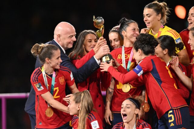 Gianni Infantino hands the 2023 Women's World Cup trophy to the Spanish team