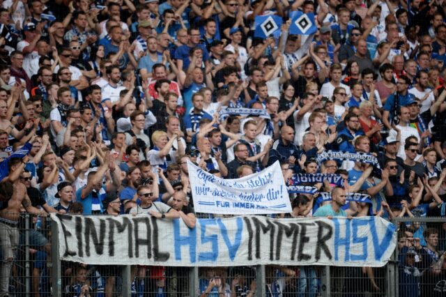 Hamburg fans display a banner reading "Once HSV, forever HSV" during a match when the club