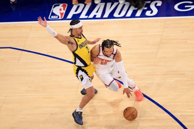 Jalen Brunson (right) drives past Andrew Nembhard in the New York Knicks win over the Indi