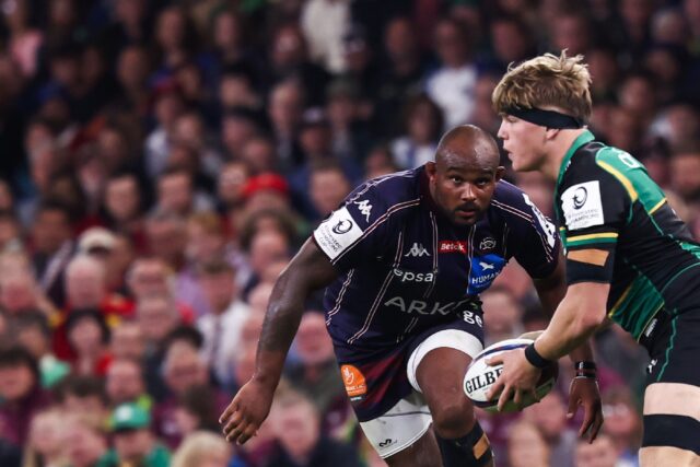 Jefferson Poirot (L) runs towards Henry Pollock in a separate incident during the Champion
