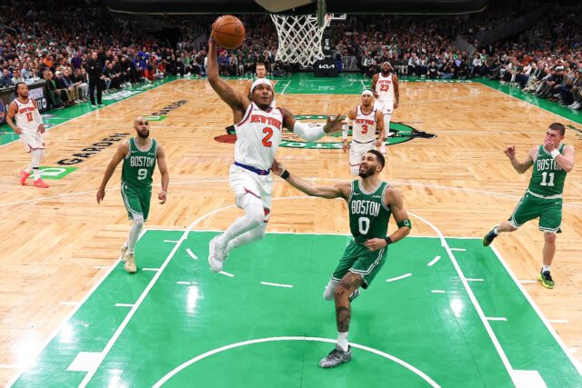 Miles McBride of the New York Knicks drives to the basket against Jayson Tatum in the Knic