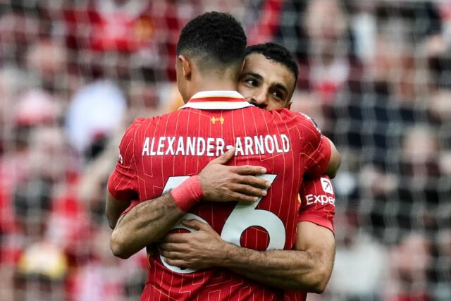 Mohamed Salah (R) celebrates with Trent Alexander-Arnold after equalising for Liverpool ag