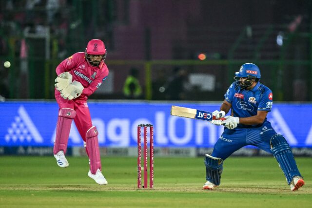 Mumbai Indians' Rohit Sharma (R) plays a shot during his side's comfortable IPL victory ov