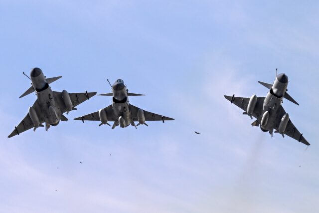 Pakistan Air Force J10-C fighter jets fly over Islamabad during a national day parade on M