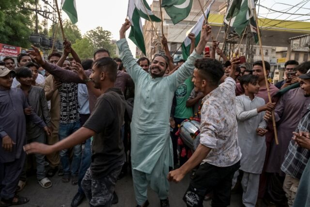 Pakistani people celebrate after the ceasefire between Pakistan and India, in Hyderabad, S