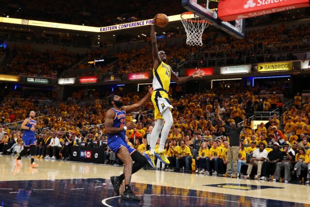 Pascal Siakam of the Indiana Pacers dunks against Mitchell Robinson in the Pacers' victory