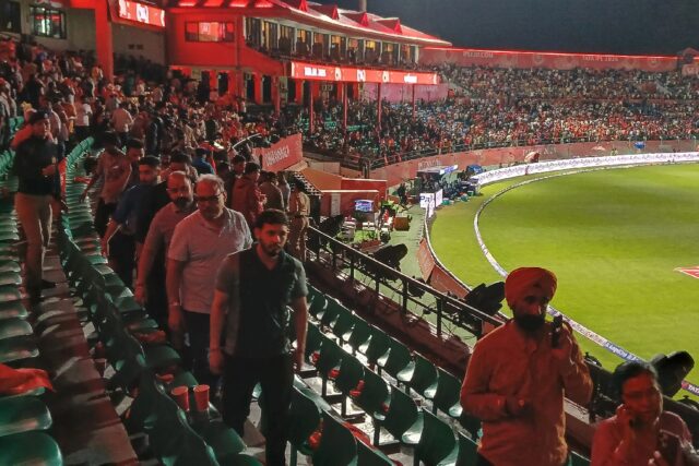 Spectators leave the ground after the IPL match between Punjab Kings and Delhi Capitals wa