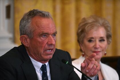 US Secretary of Health and Human Services Robert F. Kennedy Jr. (L) gestures as he speaks