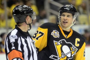 NHL referee Chris Rooney, hit in the face with a stick, expects to return to playoffs