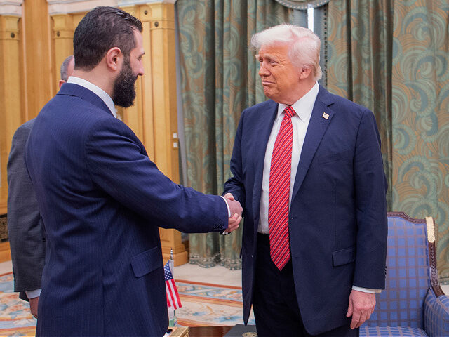 5-25-President-Donald-Trump-Syria-nterim-President-Ahmad-al-Sharaa-ap In this photo released by the Saudi Royal Palace, President Donald Trump, right, shakes ha