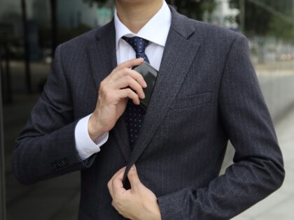 A man hides his cellphone