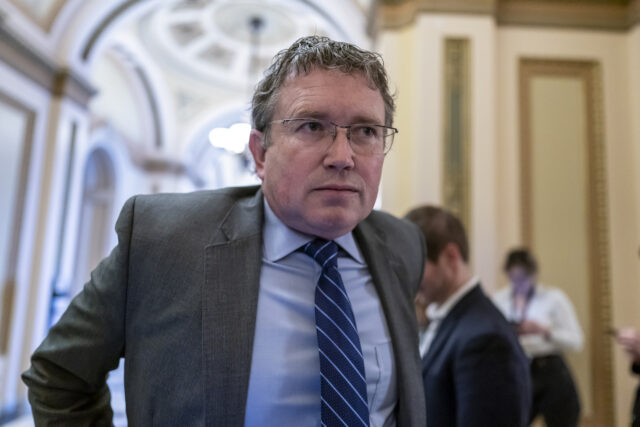 Rep. Thomas Massie, R-Ky., speaks to reporters outside the House chamber at the Capitol in