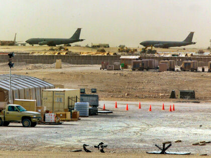 FILE - American military planes and support facilities are seen at the Al Udeid Air Base o