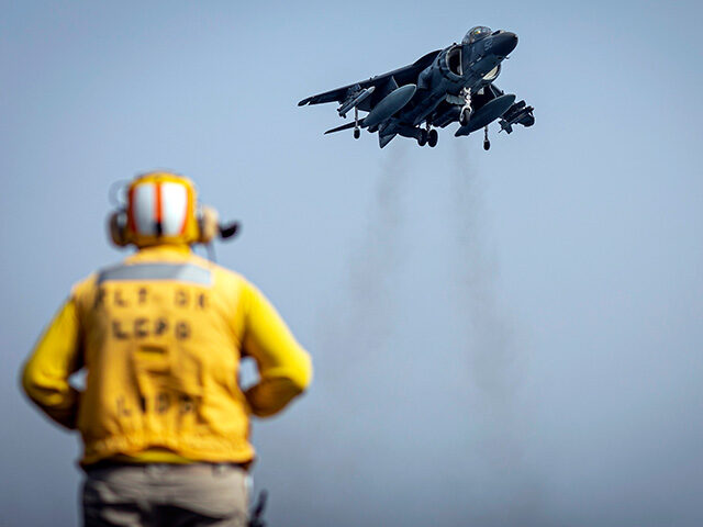 In this photo released by the U.S. Marine Corps, a sailor on the amphibious assault ship U