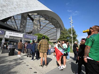 Fans wait in line to enter SoFi Stadium before a CONCACAF Gold Cup soccer match Saturday,