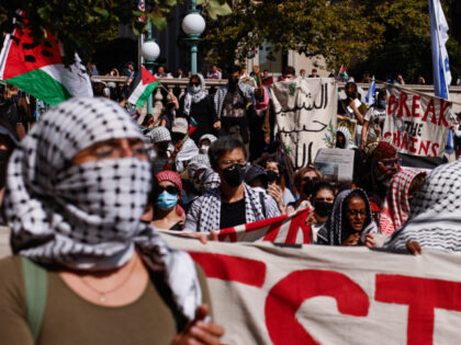 Pro-Palestinian demonstrators march through the Columbia University campus to mark one yea