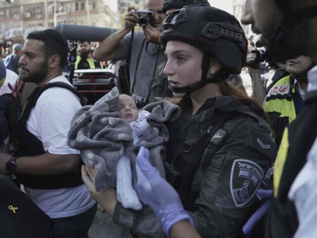 Baby Israel Iran missile (Oded Balilty / Associated Press) A baby is evacuated from the site of a direct hit from an Iranian missile strike in Ramat
