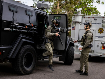Tactical teams get into position following an incident that the FBI is investigating as an