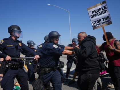 California Highway Patrol officers clash with protesters on Tuesday, June 10, 2025, in Los