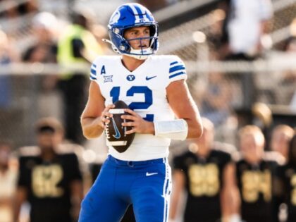 ORLANDO, FLORIDA - OCTOBER 26: Jake Retzlaff #12 of the Brigham Young Cougars looks to pas